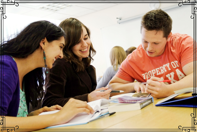 College students studying around a table.