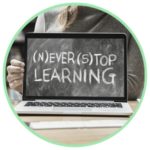 Icon for Online Community Education classes - a laptop with a photo of a chalkboard wording Never Stop Learning